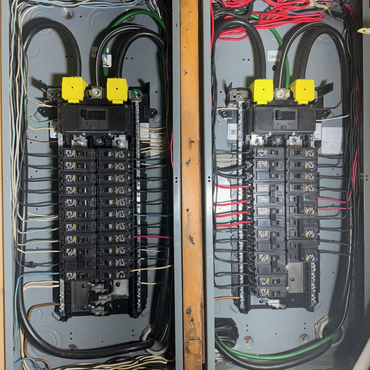 The same two panels replaced with new load centers, conductors dressed and landed