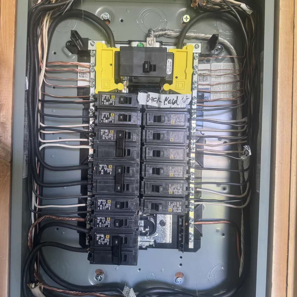 A new panel installed with breakers landed and circuits labeled